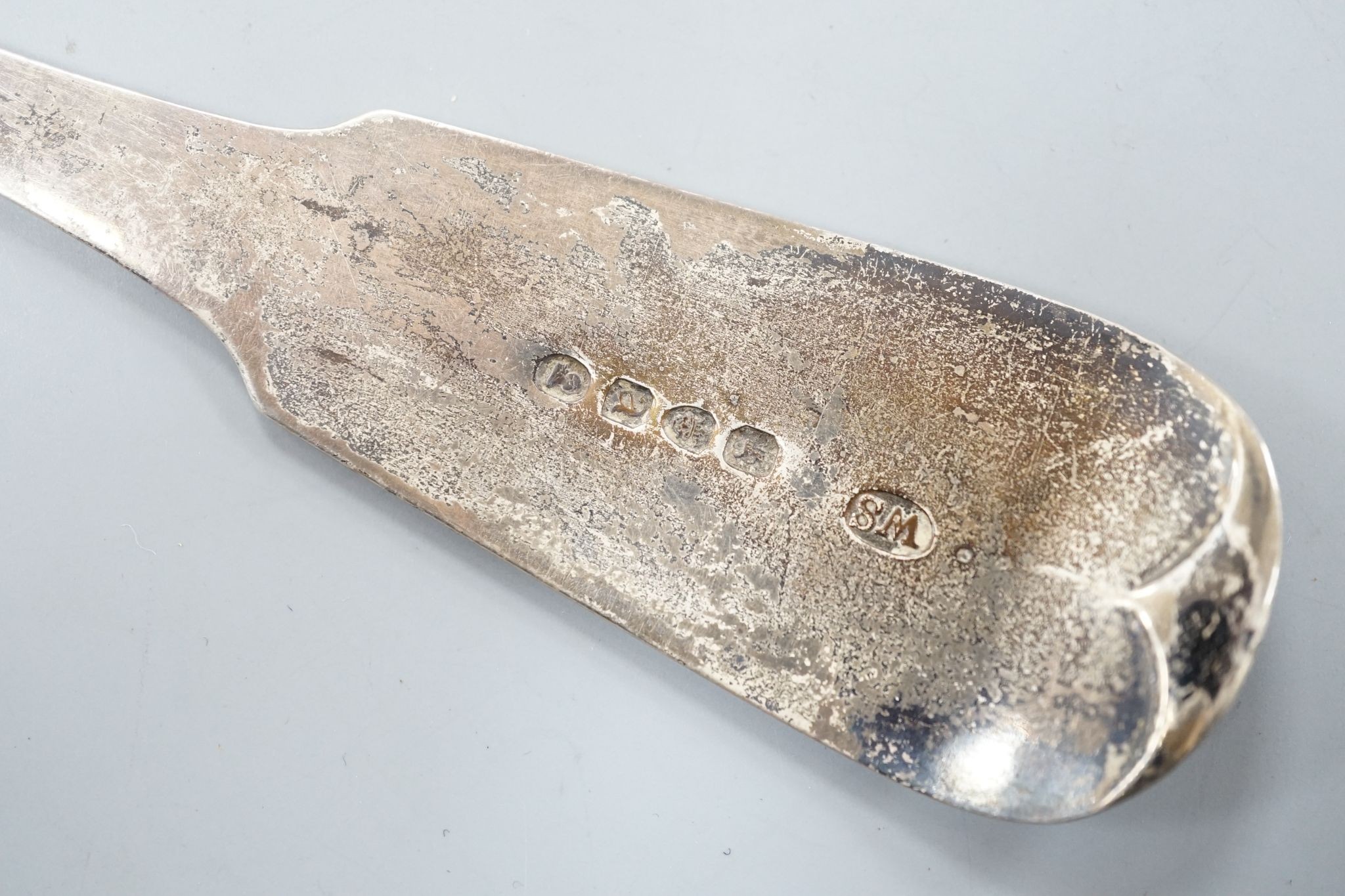 A George III silver fiddle pattern basting spoon, William Seaman, London, 1816, 31.5cm, 109 grams.